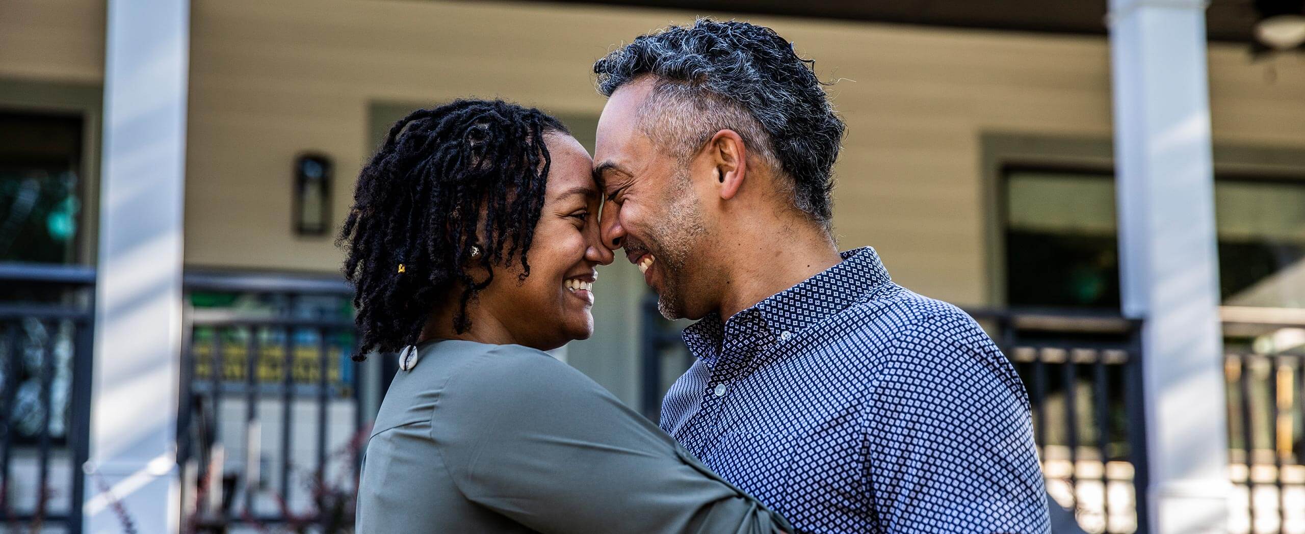 Couple at home reviewing finances after moving in.